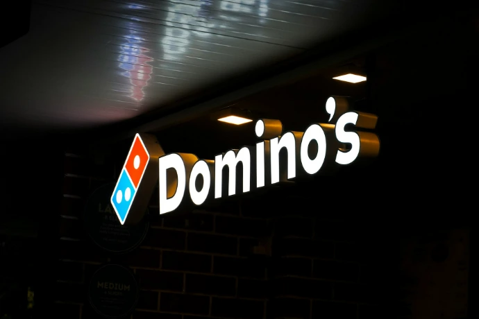Domino's pizza sign illuminated at night